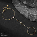 Gold bracelet with heart-shaped beads on a dark surface