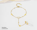 Gold bracelet with heart-shaped links on a white background