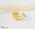 Gold ring on a white background with a soft yellow ribbon