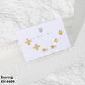 Gold earrings on a jewelry card with 'Jewelry' text on a white textured background